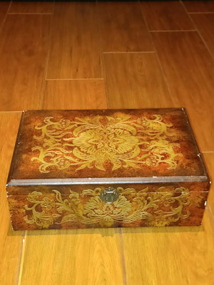 Wooden antique box used with embossed bronze decorations