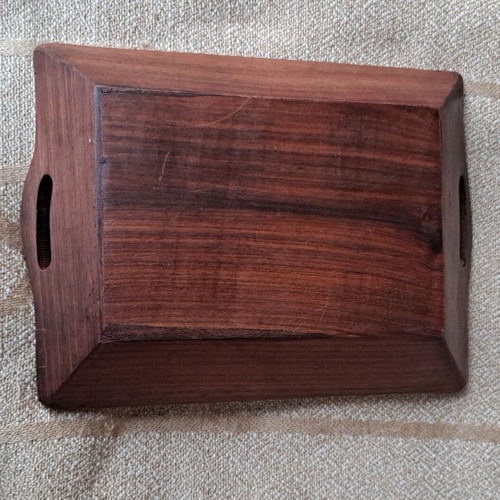 Vintage wooden serving tray used with carved floral motif