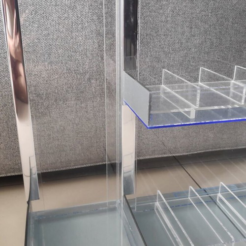 Tabletop plexiglass product display stand like new with metal decorations