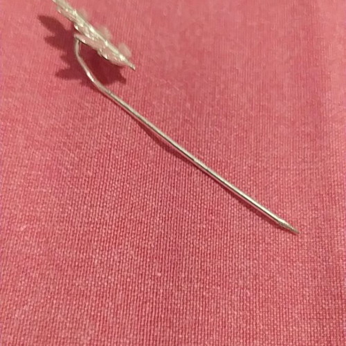 Vintage lapel pin used, silver color