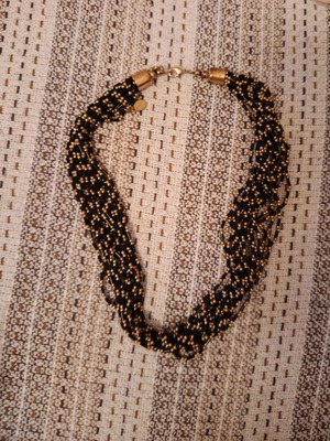 Necklace used in gold and black with beads
