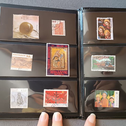 Stamp album with 120 stamps like new, Greece Australia Cyprus Germany America Canada
