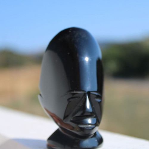 Obsidian African face sculpture
