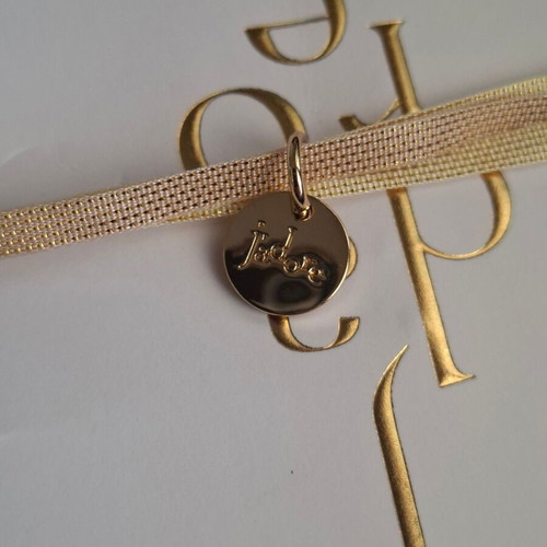 Dior bracelet with charm and adjustable ribbon new, gold and beige