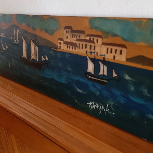 Artwork used with sea, ships and harbor image on wooden board