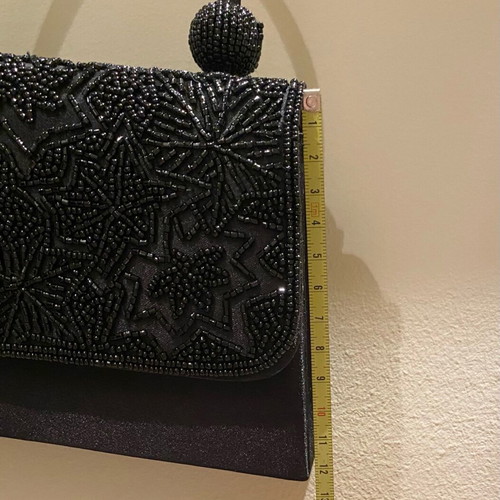 Mini black handbag like new with beaded embossed design