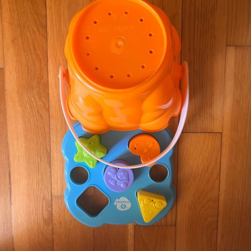 Beach bucket with shape sorting toy used