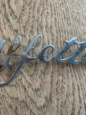 Alfa Romeo Alfetta emblem used with slight peeling