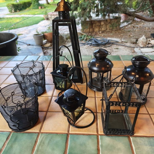 Set of eight lanterns and candle holders for garden decoration