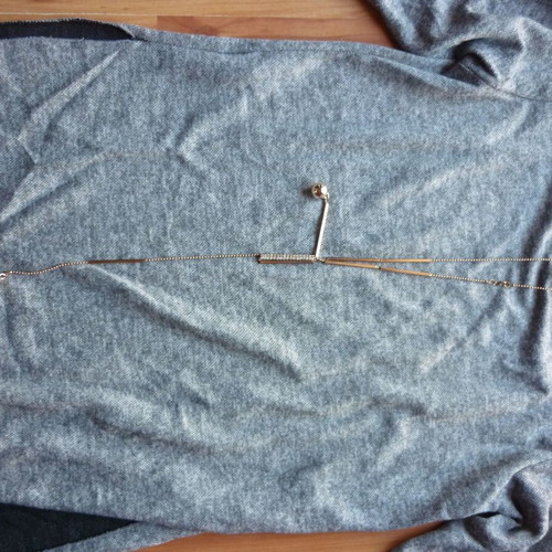 Women's blouse M/L gray like new, long back with hanging details