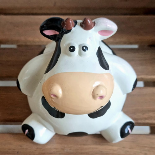 Ceramic cow piggy bank like new, black and white