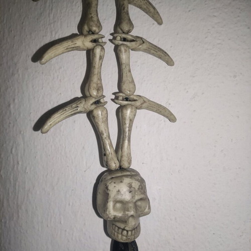 Halloween hanging decoration used with bone and skull appearance