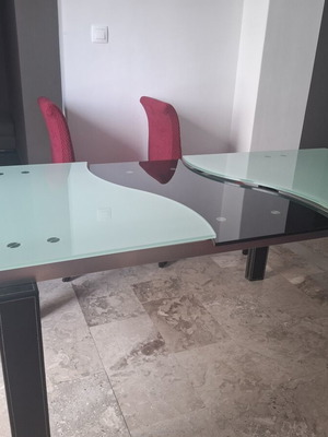 Dining table like new with leather frame and glass top