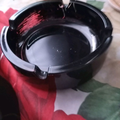 Glass ashtray vintage black classic with four cigarette slots used