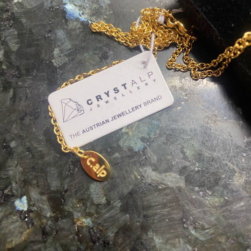 Crystalp steel cross gold color new with missing stone