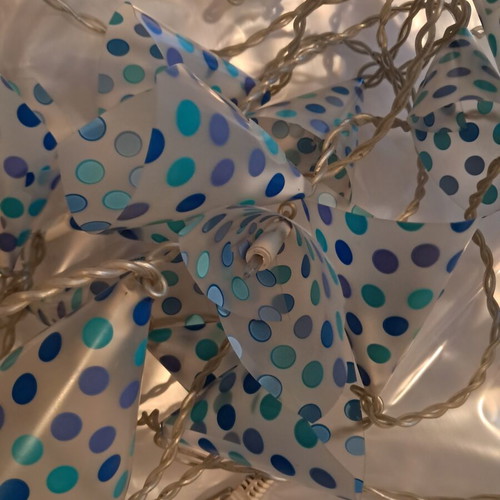 Decorative hanging lights used, blue polka dot