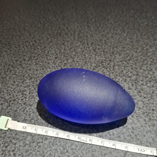 Vintage decorative crystal egg with blue matte glass and gold metal base used