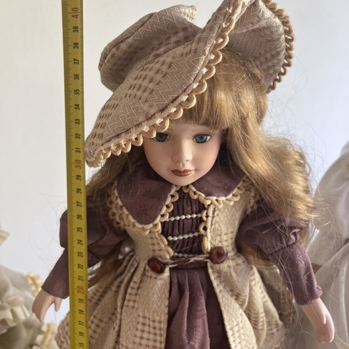 Porcelain doll with hat, 40 cm