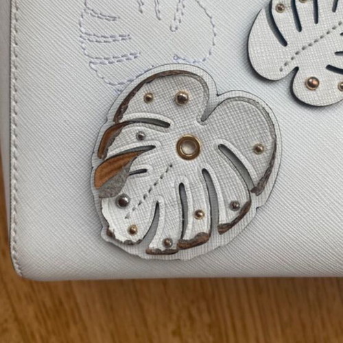 Michael Kors white tote bag with floral and dragonfly details
