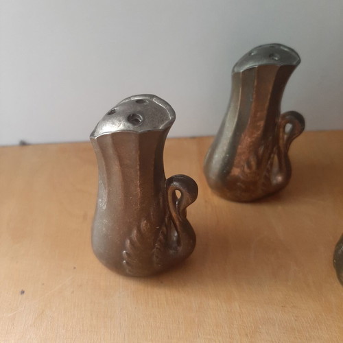 Vintage salt and pepper set with swan designs, used, 4 pieces