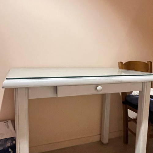 Wooden desk with glass surface and drawer used