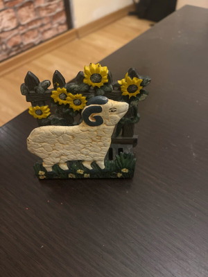 Vintage cast iron napkin holder with ram and sunflowers like new