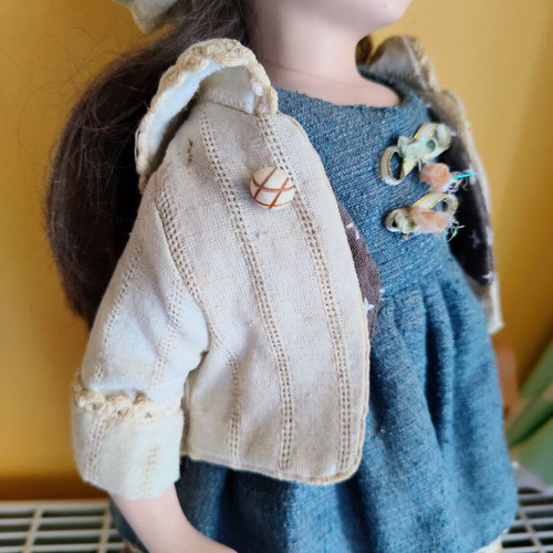 Porcelain doll with stand, 42 cm
