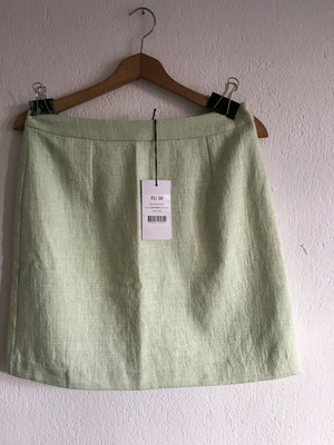 new green mini skirt with tag
