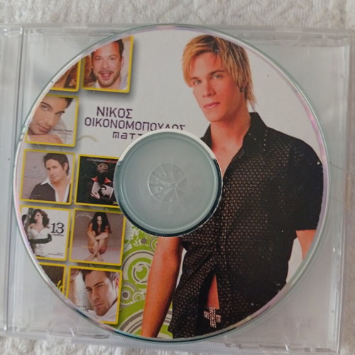 CD with 20 songs by various Greek artists like new, laiko