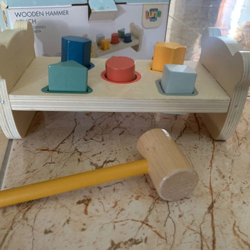 Wooden bench with colorful figures and hammer, like new