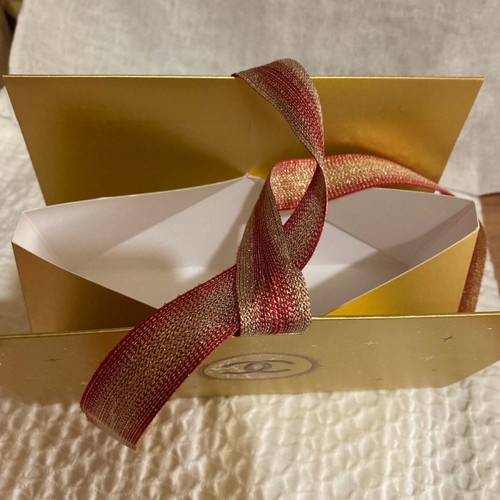 Chanel gift box new in gold color with ribbon