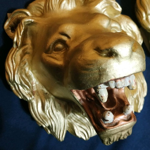 Decorative items used, cast iron lion heads, old antiques