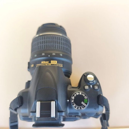 Nikon D3000 camera with AF-S 18-55mm f/3.5-5.6 lens and bag