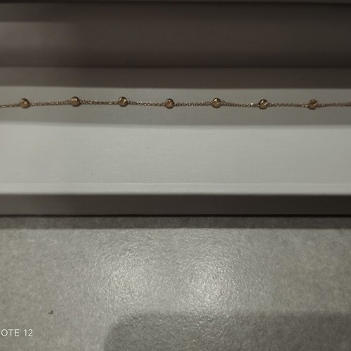 9k gold bracelet with diamond-studded beads