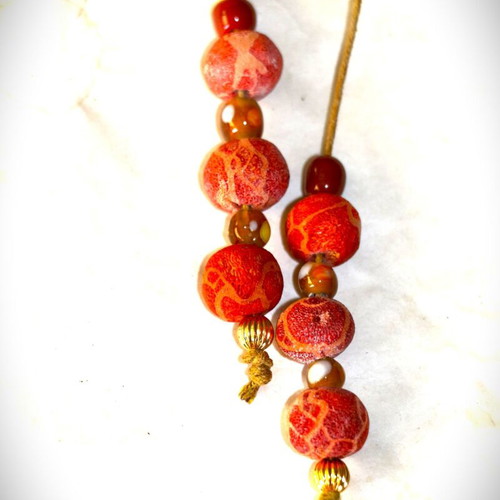 Begleri with genuine coral and 22K gold-plated beads, handmade by Indico Jewells
