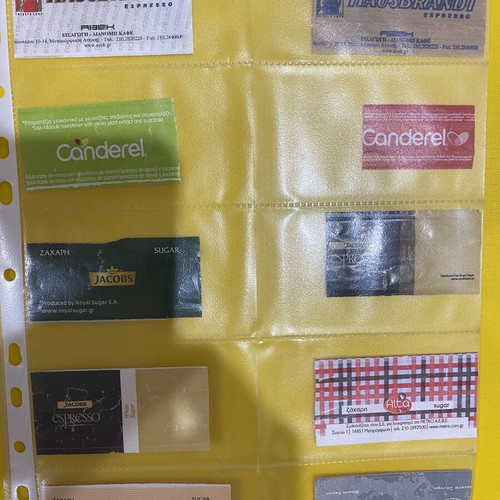 Sugar packet collection, 69 in holders plus 5 loose