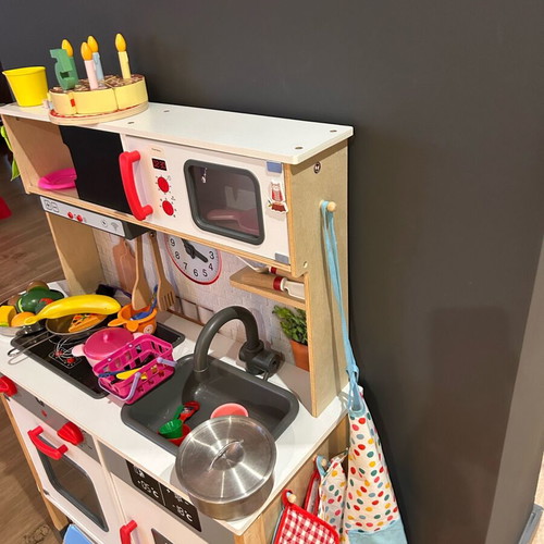 Wooden children's kitchen used with utensils