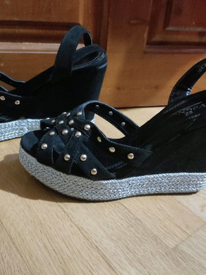 Platform shoes used with studs and double ankle strap