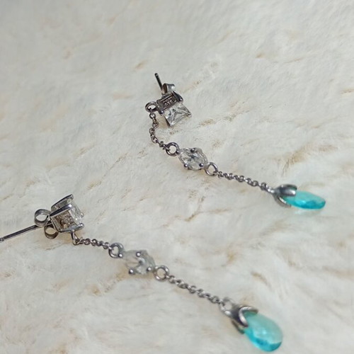 Silver earrings with white and turquoise stones used
