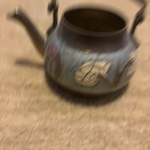Handmade used brass decorative teapot with carved floral designs