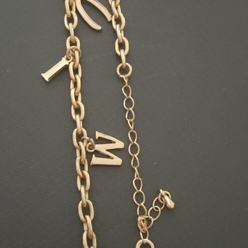 Necklace like new, gold stainless steel with letters