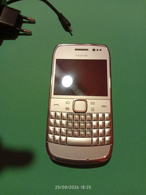 Nokia E6-00 mobile phone, silver, 8 MP camera, Symbian Anna