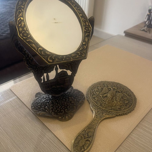 Set of two brass mirrors, table and hand used