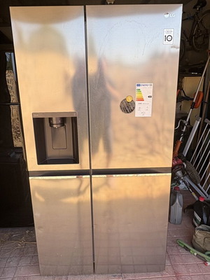 LG side-by-side refrigerator with water and ice dispenser