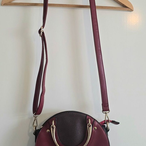 Round red shoulder bag