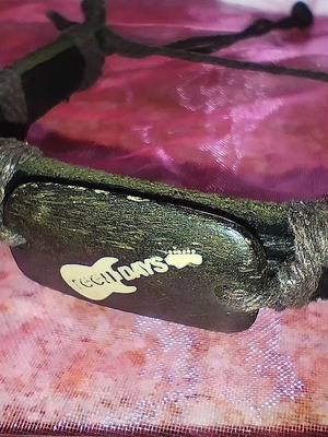 Brown bracelet new with wooden guitar decoration and cord details
