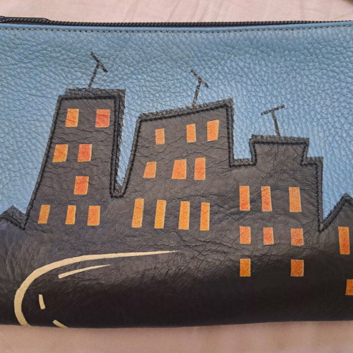 Handmade leather crossbody bag with urban design