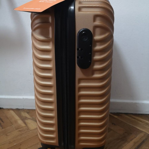 Small suitcase new, gold color