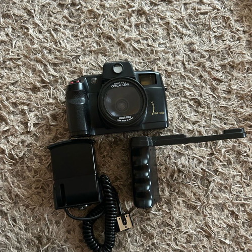 Sony camera like new with handle, flash, and bag
