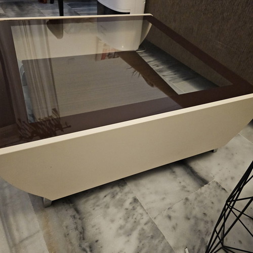 Coffee table used with glass top and storage space, brown and beige